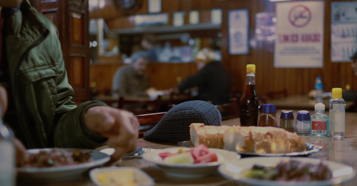 Intimate dining scene in a Turkish eatery with delicious bread and meals on a wooden table.