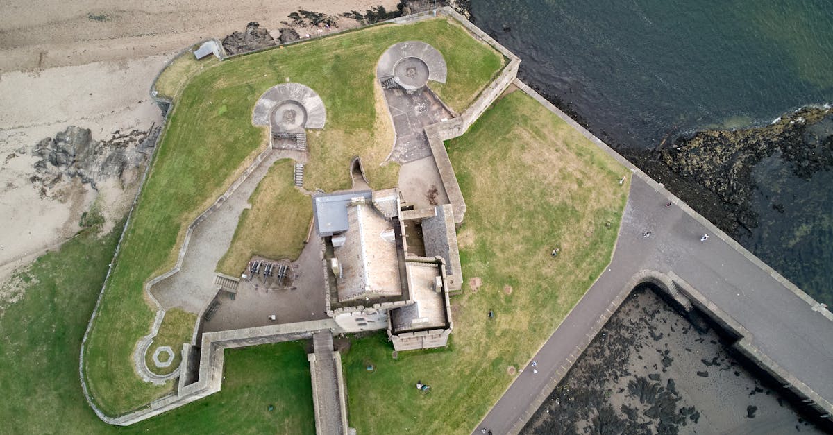 A stunning aerial shot of Broughty Castle overlooking the coast in Broughty Ferry, Scotland.