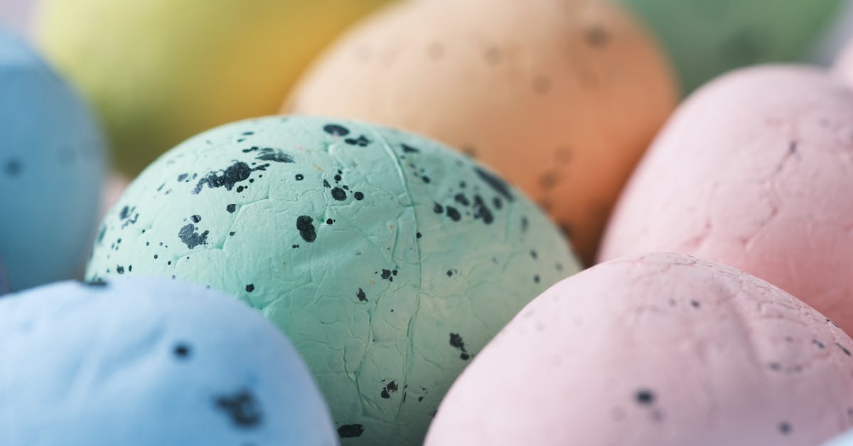 Close-up of colorful painted Easter eggs showcasing vibrant pastel colors and textures.