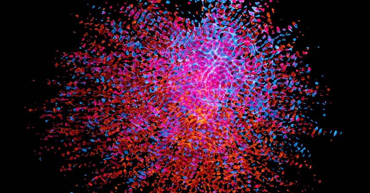 Dynamic abstract artwork with vibrant splashes of color against a dark background, creating a dynamic visual explosion.
