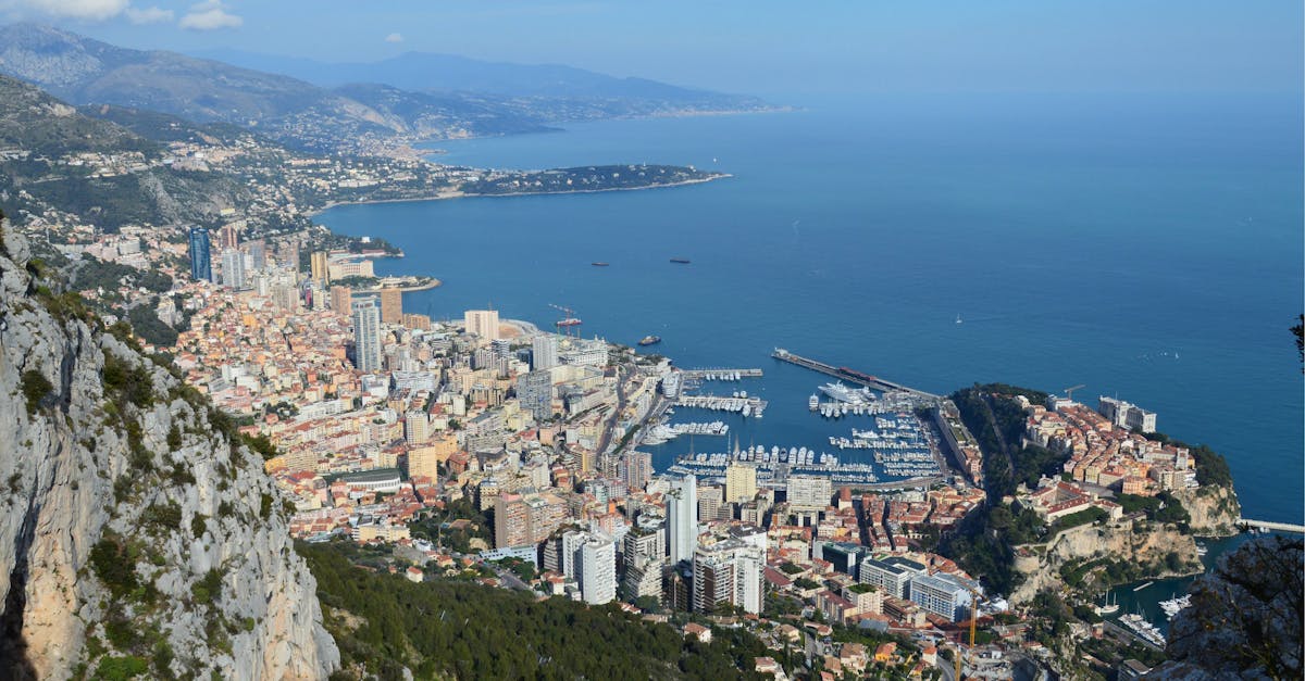 Breathtaking birds-eye view of Monaco cityscape and harbor on a sunny day.