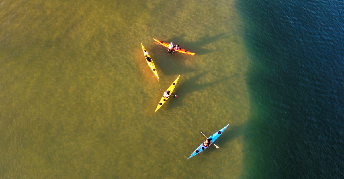 Drone shot capturing vibrant kayaks on the calm waters of Ashdod, Israel, offering a vibrant and active scene.
