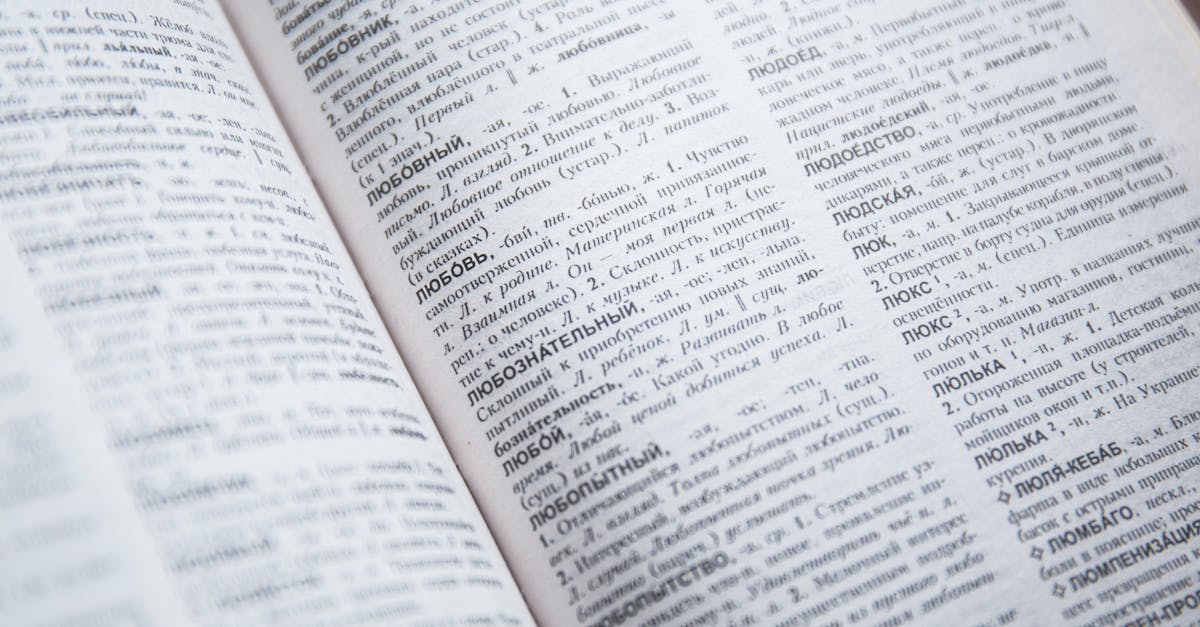 Close-up view of an open Russian dictionary showing detailed text and entries.