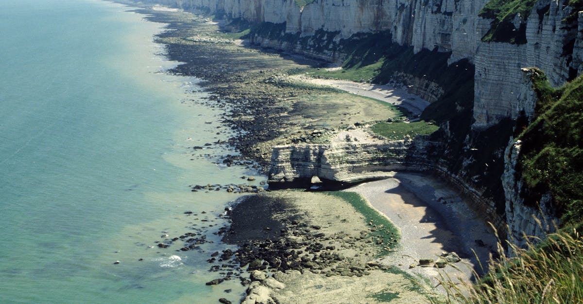 Breathtaking view of Étretat white cliffs along the coast in Normandie, France.