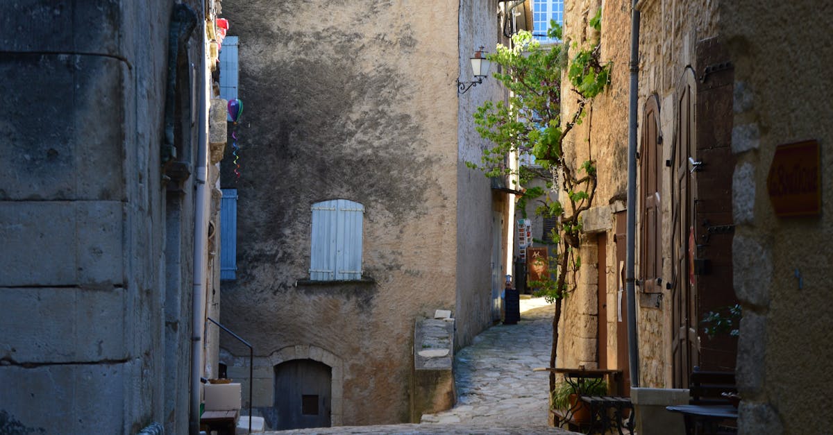 Discover a charming narrow cobblestone alleyway in an old European town, perfect for a journey through time.