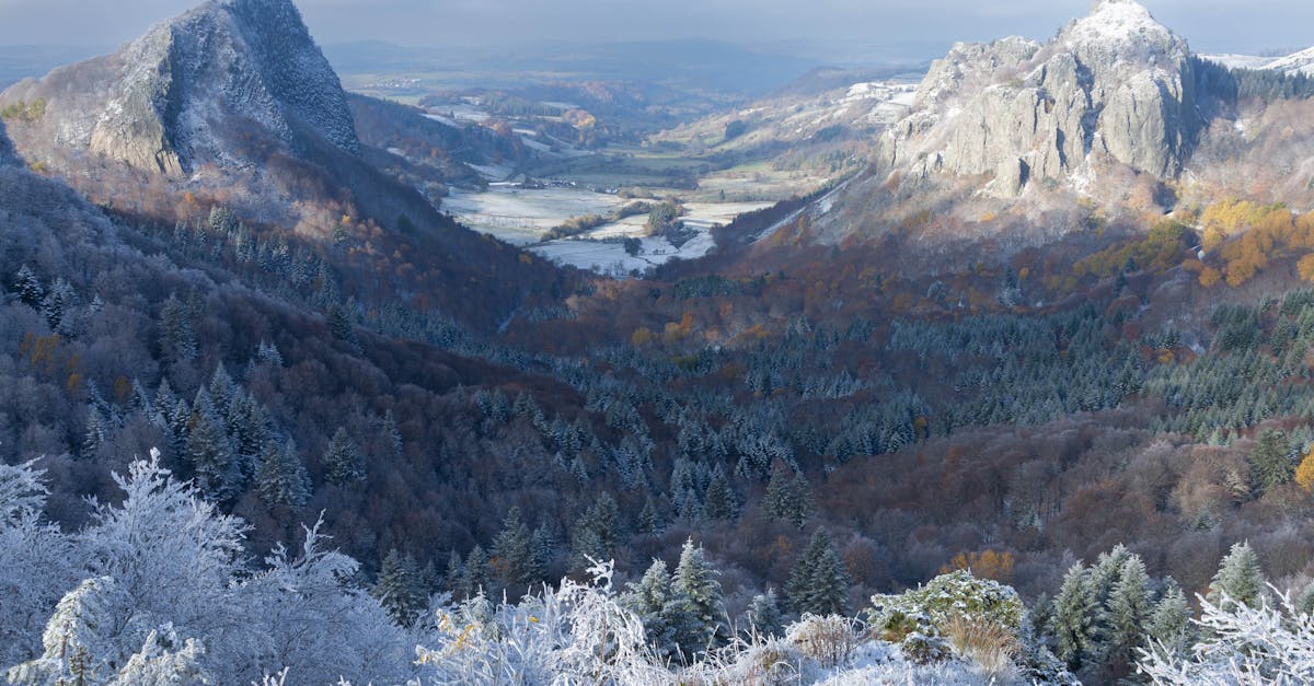 Stunning winter view of Le Mont-Dore's snowy peaks and valleys in Auvergne, France.