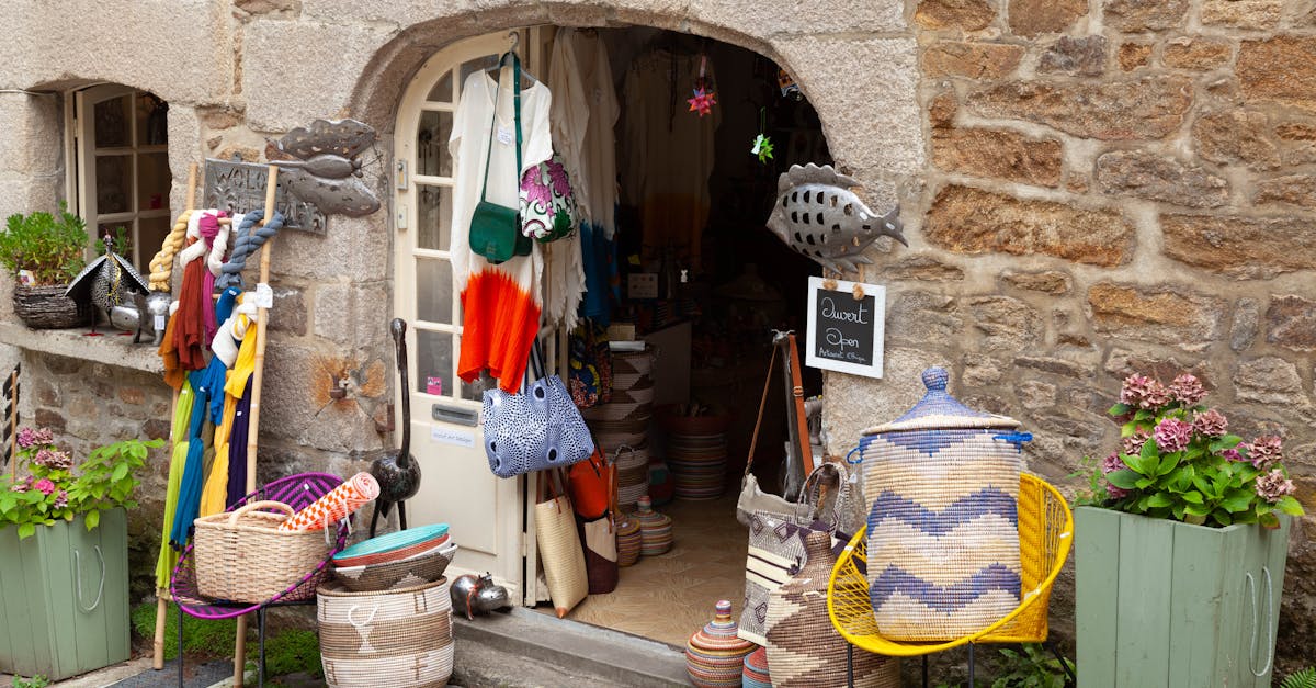 Colorful craft shop in Dinan, Brittany with baskets and textiles on display.