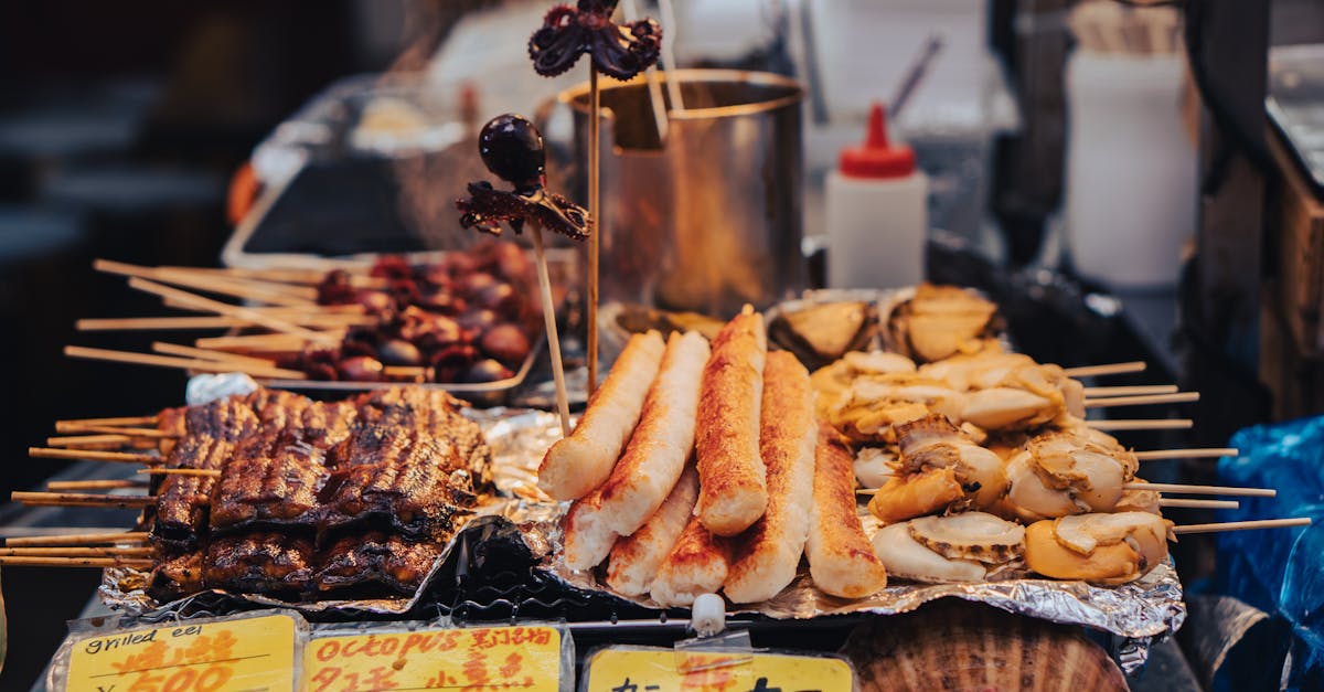 A diverse selection of grilled skewers showcasing delicious Japanese street food at a bustling market stall.
