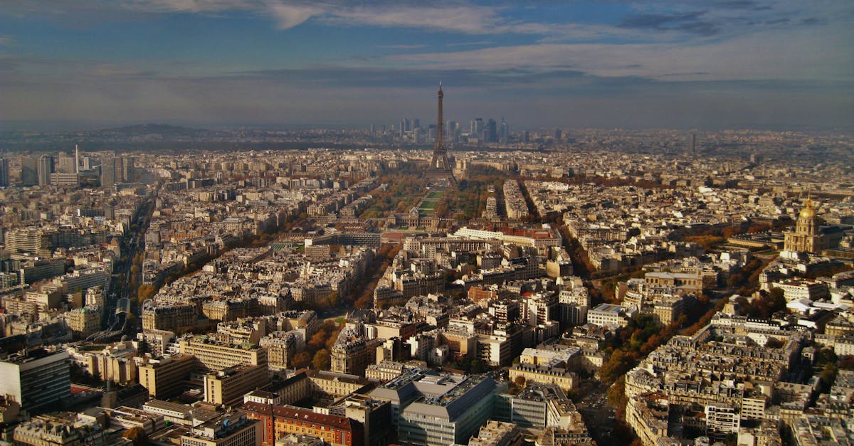 Stunning aerial view of Paris featuring the iconic Eiffel Tower and urban landscape.