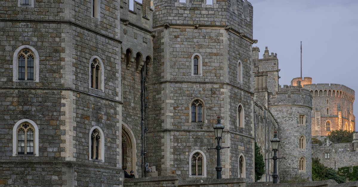 Explore the historic stone architecture of Windsor Castle, a prominent landmark in the UK.