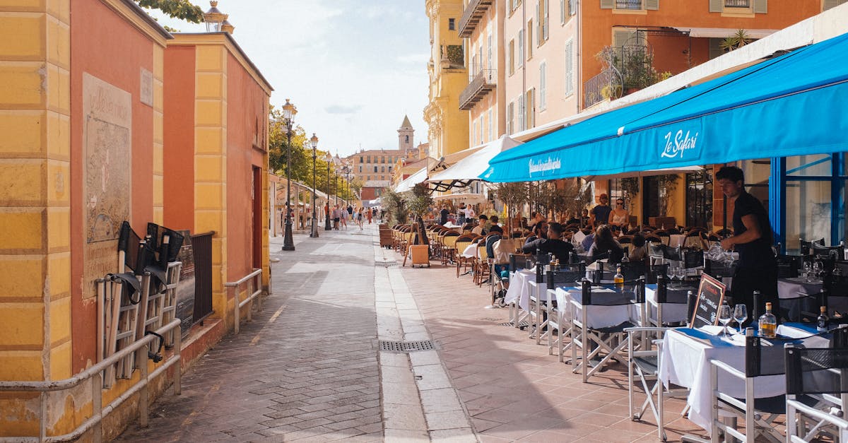 Cozy outdoor cafe seating in Nice, France. Perfect for a summer day out.