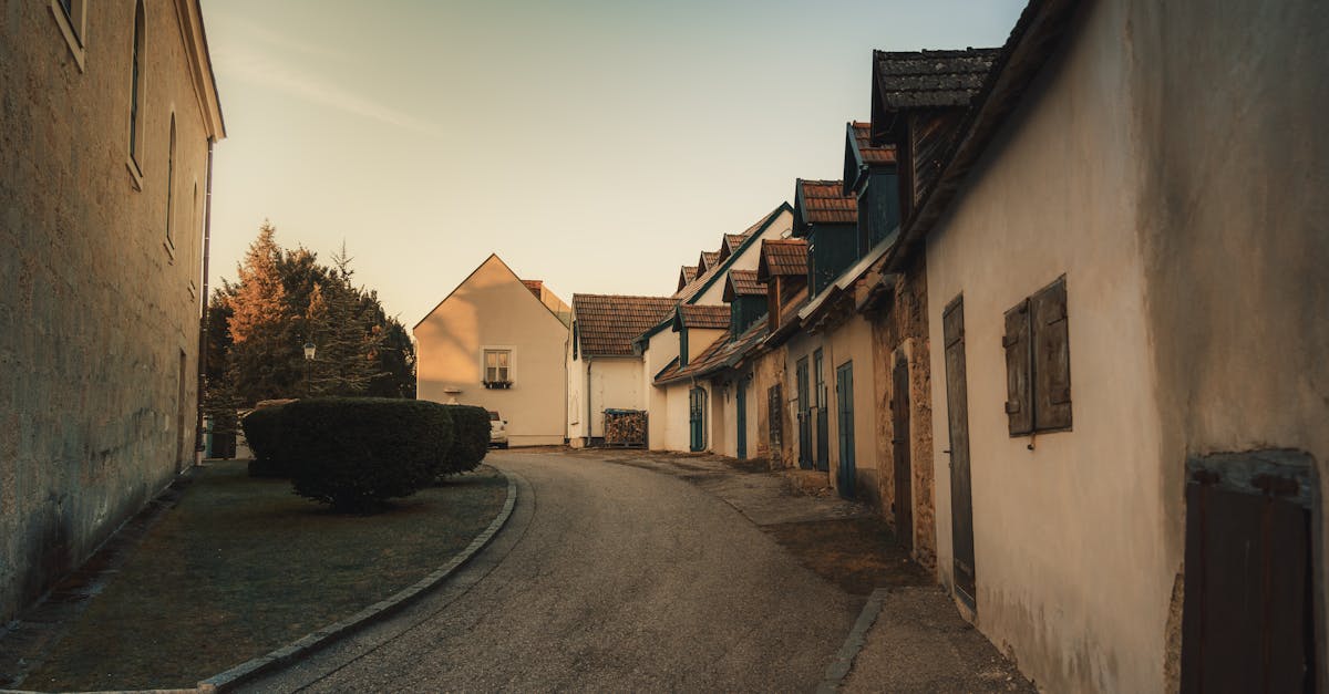 Serene street view in an Austrian village during sunset, capturing quaint architecture.