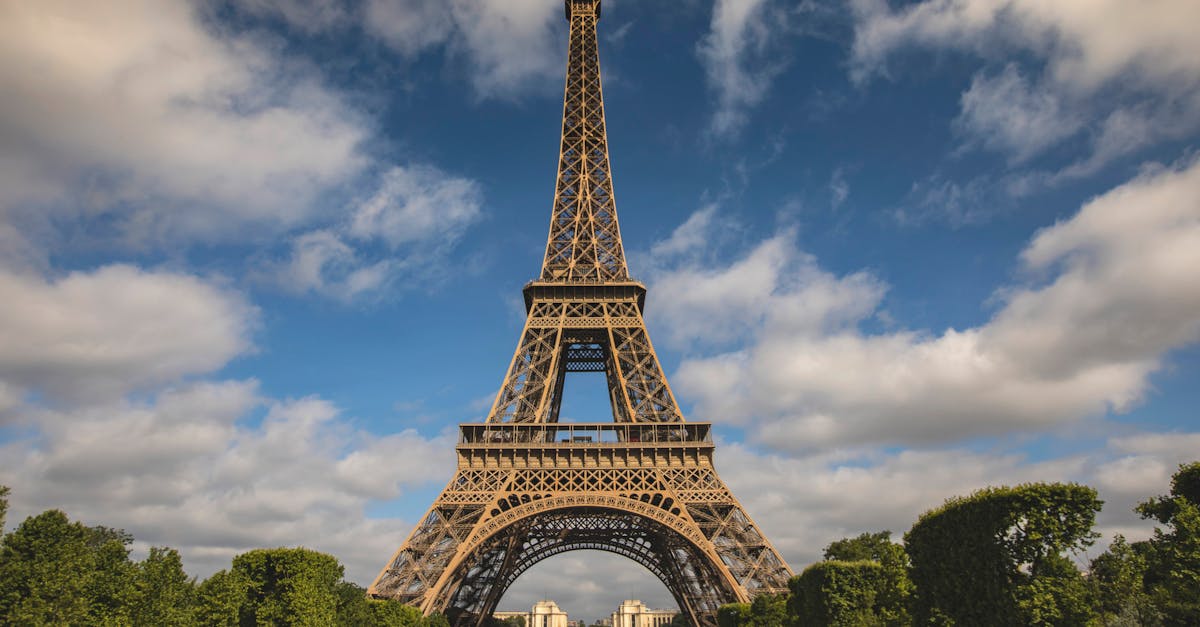 A breathtaking view of the Eiffel Tower against a blue sky in Paris, France.