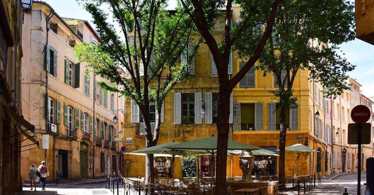 Picturesque street corner in Aix-en-Provence, showcasing traditional architecture and vibrant outdoor café setting.