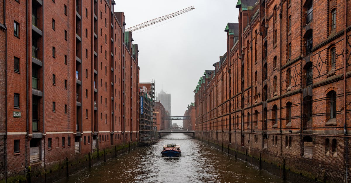 Charming view of boat sailing through historic Speicherstadt canal in Hamburg.