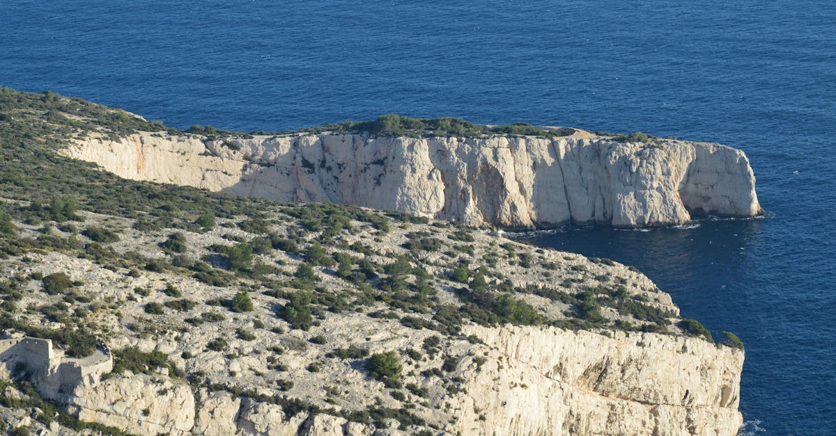 Breathtaking view of rocky cliffs and blue sea in Marseille, France.