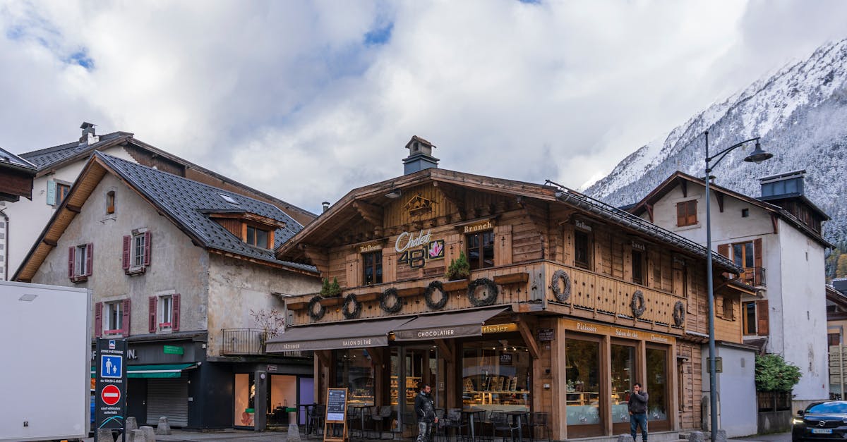 Quaint bakery in Chamonix, France against a scenic Alpine backdrop.