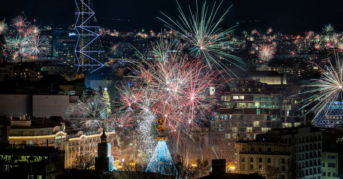 Spectacular fireworks lighting up the night sky over Tbilisi's vibrant cityscape.