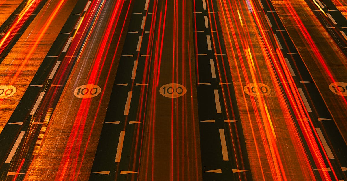 Long exposure night shot of busy expressway in Dubai illustrating urban speed and motion.