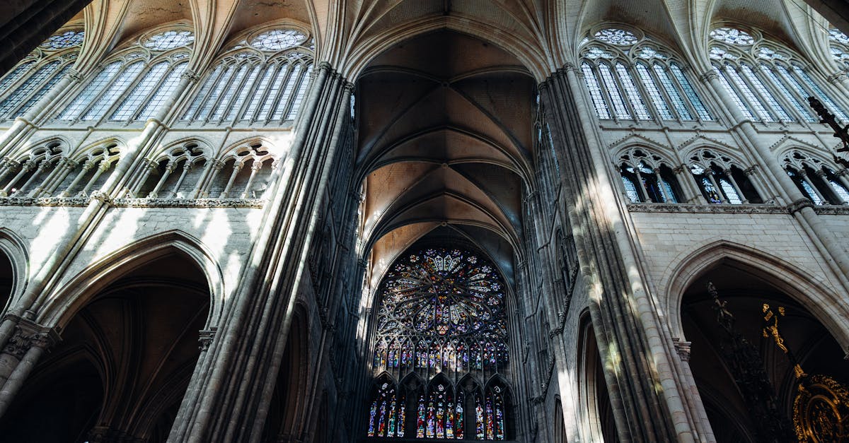 Explore the breathtaking Gothic architecture and stained glass of Amiens Cathedral's interior.