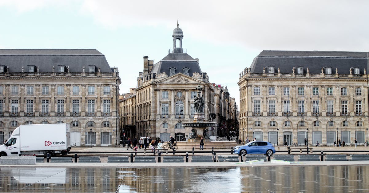 Stunning view of Place de la Bourse in Bordeaux with reflection on wet pavement.
