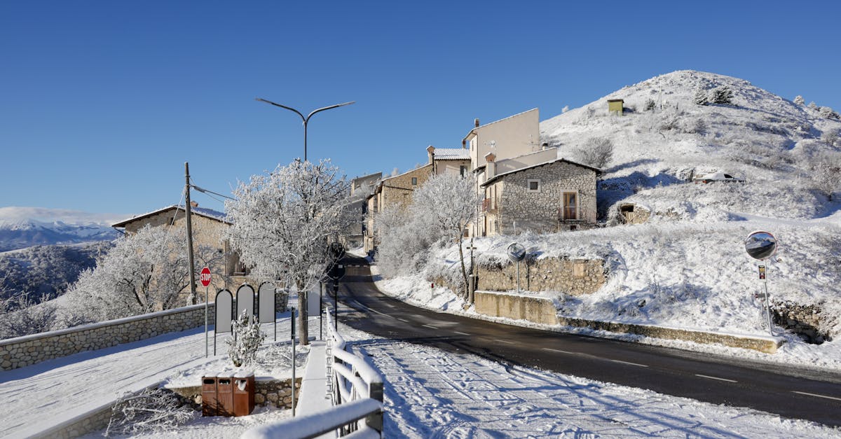 Scenic view of a picturesque Italian village covered in snow during winter.