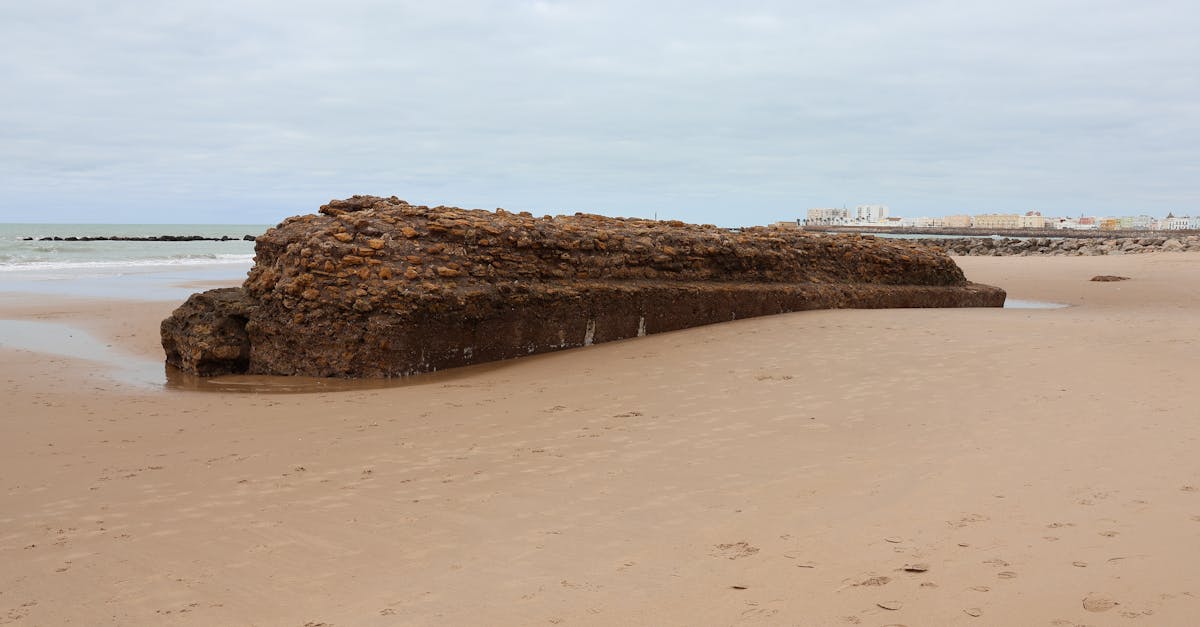 Explore the historic ruins on Cádiz beach in Andalucía, Spain, a blend of history and nature.