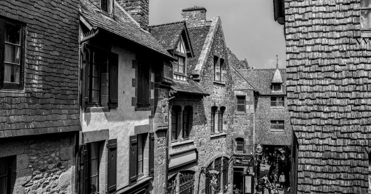 Charming medieval street in black and white at Mont Saint-Michel, France.