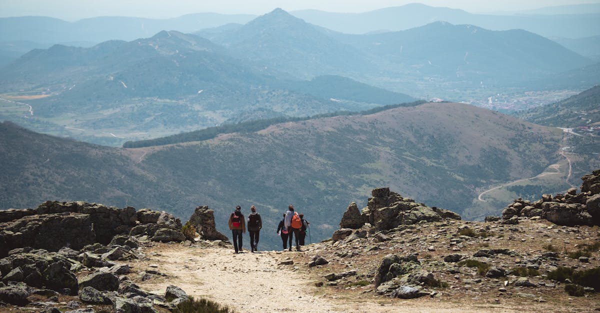 Group of hikers walking in the scenic mountains of Spain, enjoying nature and adventure.
