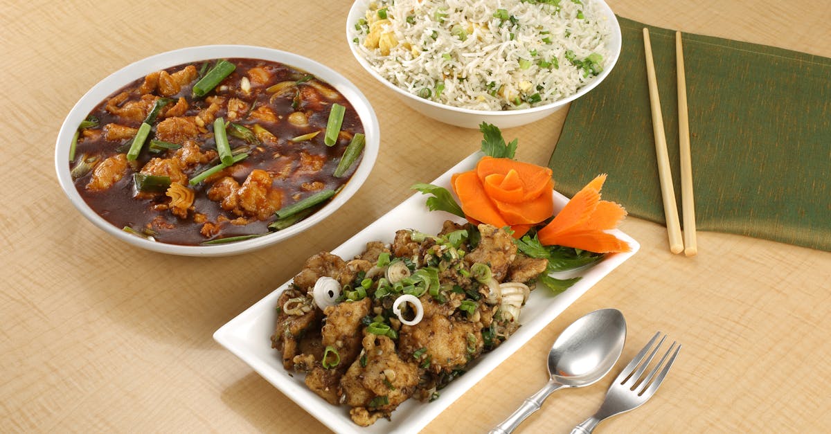 Savor a mouthwatering spread of Asian dishes featuring fried rice and flavorful chicken.