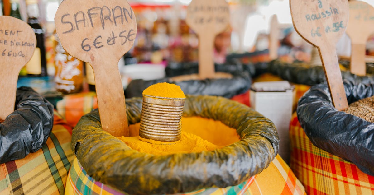 Vibrant spice market with sacks of colorful saffron and other spices displayed outdoors.