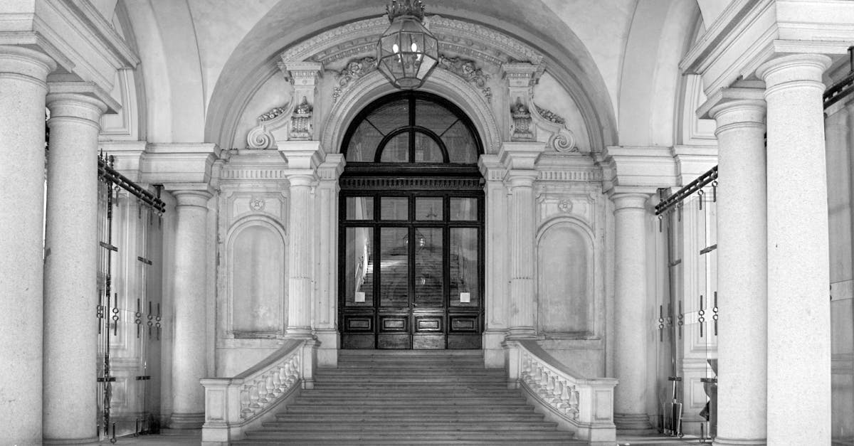 Elegant baroque facade with arched windows and columns in Torino, Italy.