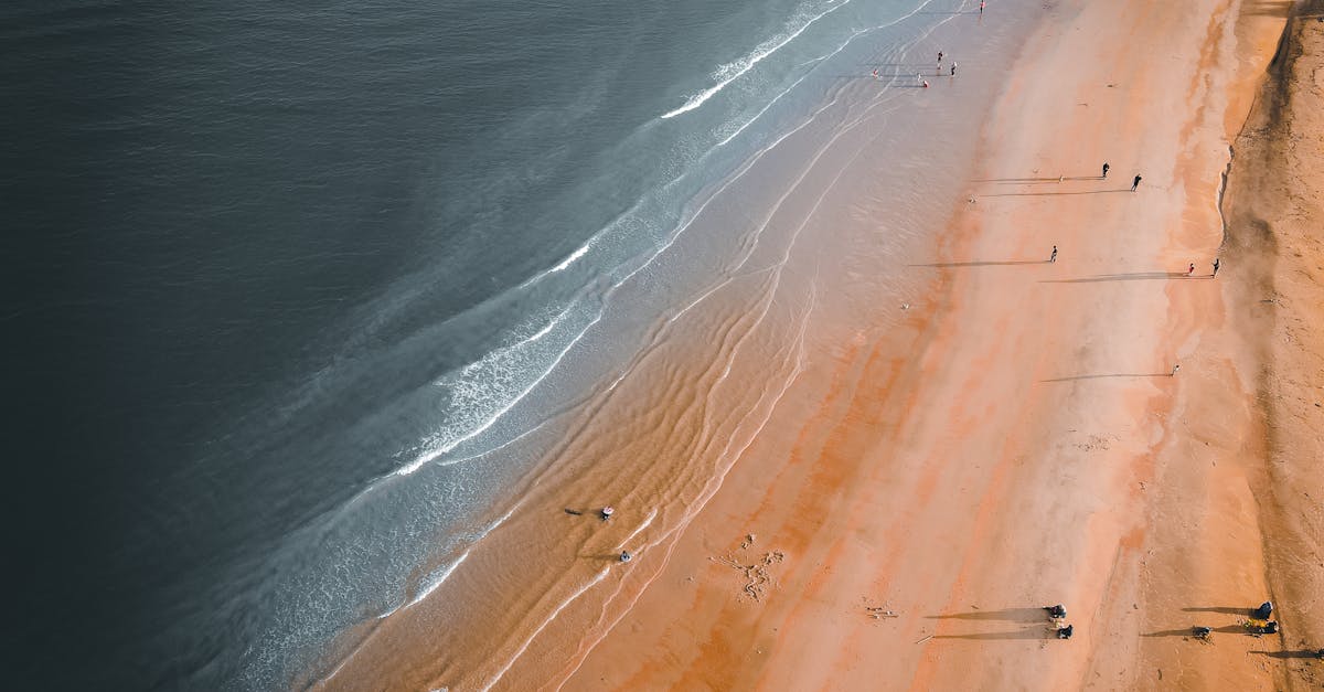Aerial view of Chukai beach with serene waves and golden sand, Terengganu, Malaysia.